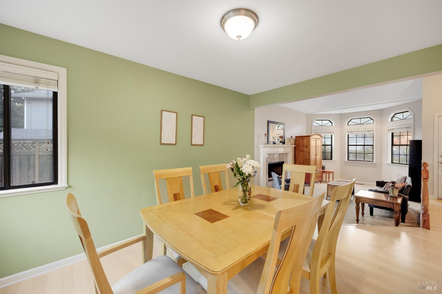 504 Jenifer Court Santa Rosa, CA 95404 - Photo 7 of 61 a view of a dining room with furniture and wooden floor