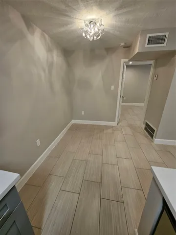 a view of a yard with plants and a trees