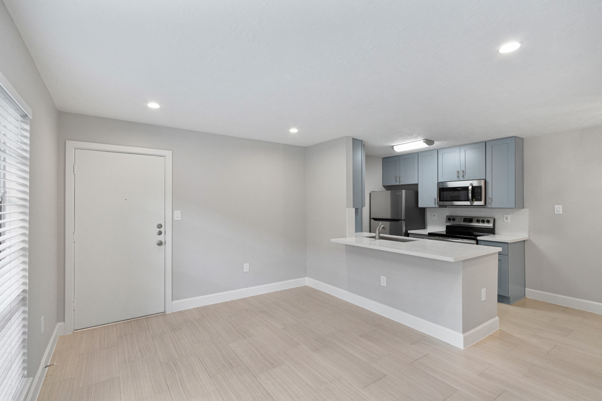 2101 Fountain View Drive, Unit 4 6 Houston, TX 77057 - Photo 4 of 26 a kitchen with stainless steel appliances a sink and a refrigerator