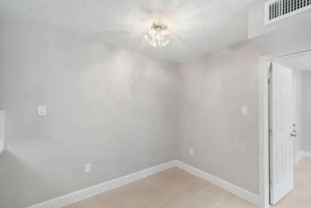 a kitchen with stainless steel appliances a sink stove and refrigerator