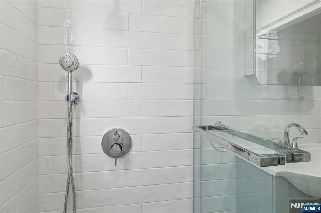 74 Forest Street, Unit 1 Montclair, NJ 07042 - Photo 14 of 23 a bathroom with a shower and sink
