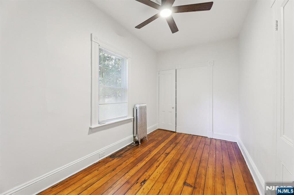 74 Forest Street, Unit 1 Montclair, NJ 07042 - Photo 16 of 23 a view of a room with wooden floor closet and windows