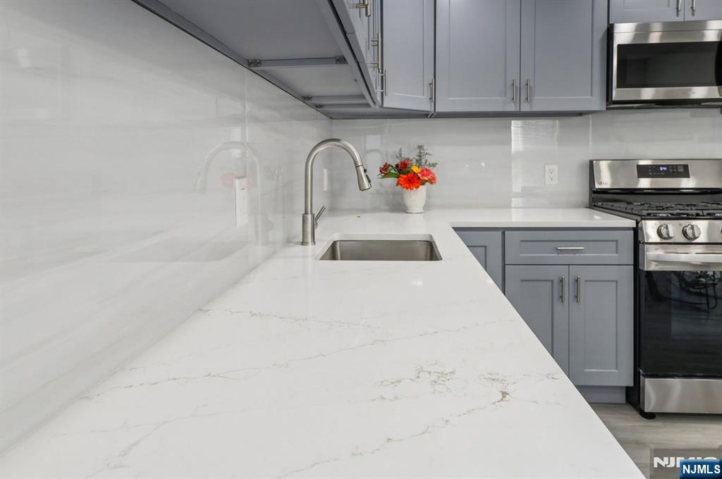 74 Forest Street, Unit 1 Montclair, NJ 07042 - Photo 5 of 23 a kitchen with a sink and cabinets