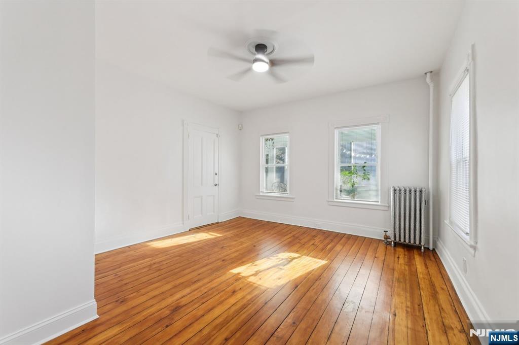 74 Forest Street, Unit 1 Montclair, NJ 07042 - Photo 10 of 23 wooden floor in an empty room with a window