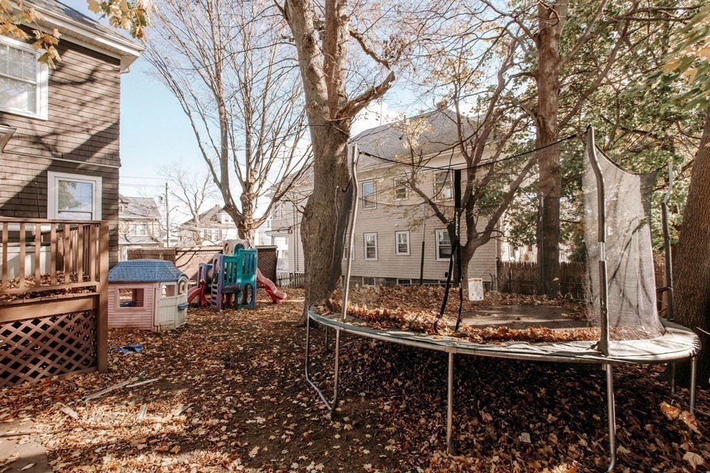 147 Train Street Boston, MA 02122 - Photo 21 of 27 a view of a backyard with table and chairs