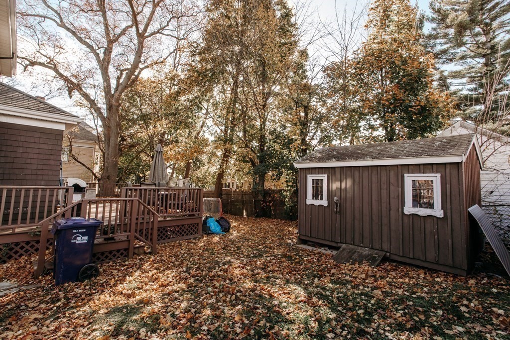 147 Train Street Boston, MA 02122 - Photo 22 of 27 a backyard of a house with table and chairs