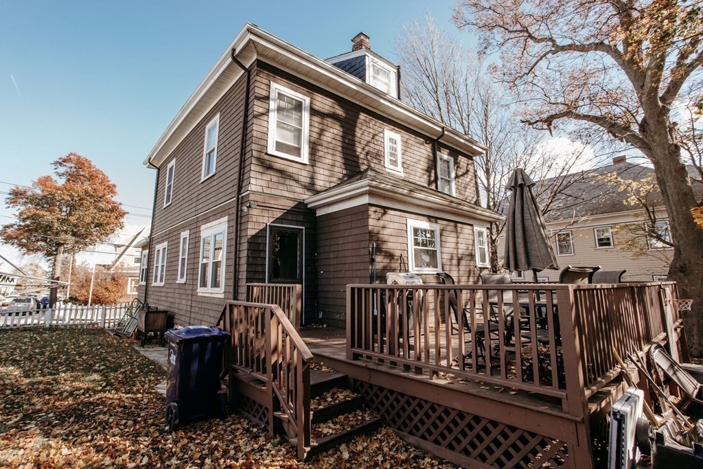 147 Train Street Boston, MA 02122 - Photo 3 of 27 a front view of a house with a bench