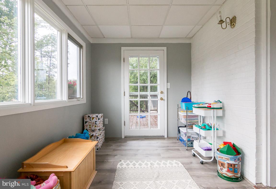416 Hillen Road Baltimore, MD 21286 - Photo 9 of 47 New flooring in play room/ sunroom