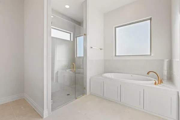 a bathroom with a double vanity sink and mirror