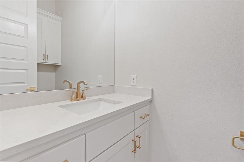 412 Collum View Azle, TX 76020 - Photo 19 of 29 a bathroom with a sink and vanity