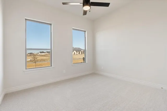an empty room with windows and window