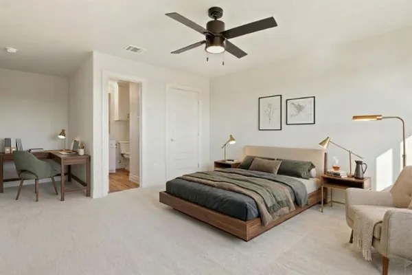 a bedroom with bed and a couch