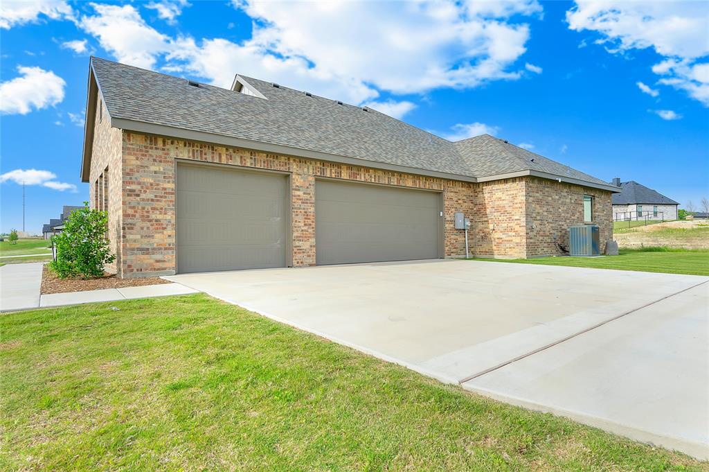 412 Collum View Azle, TX 76020 - Photo 29 of 29 a front view of a house with a yard and garage