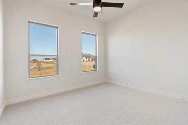 a bedroom with a bed and a lamp