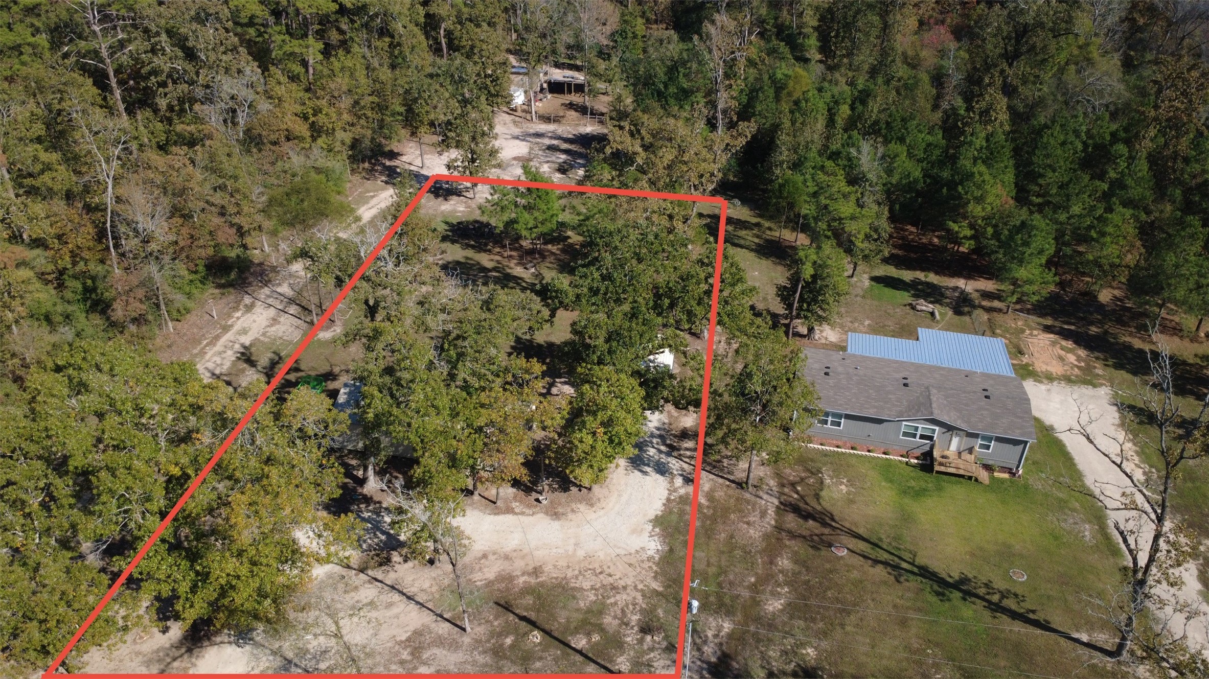 an aerial view of residential house with outdoor space