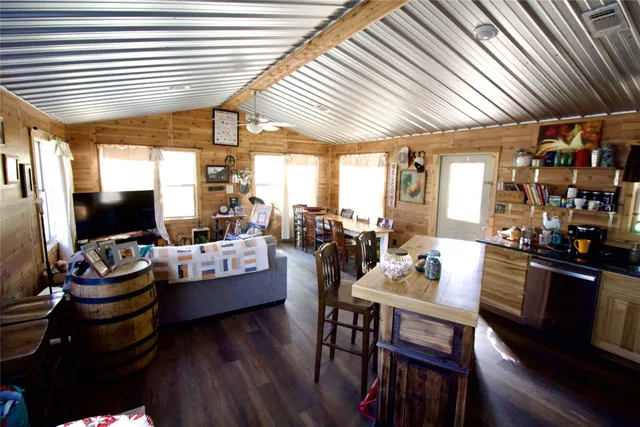 a living room with lots of furniture and a flat screen tv
