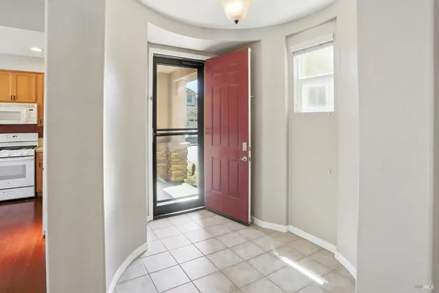 a view of a livingroom with wooden floor a fireplace
