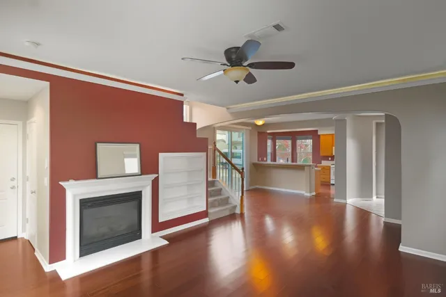 a white toilet sitting next to a bathroom sink