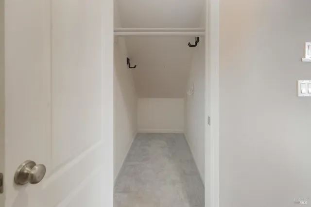 a open kitchen with stainless steel appliances granite countertop a stove a sink dishwasher and a microwave with wooden floor