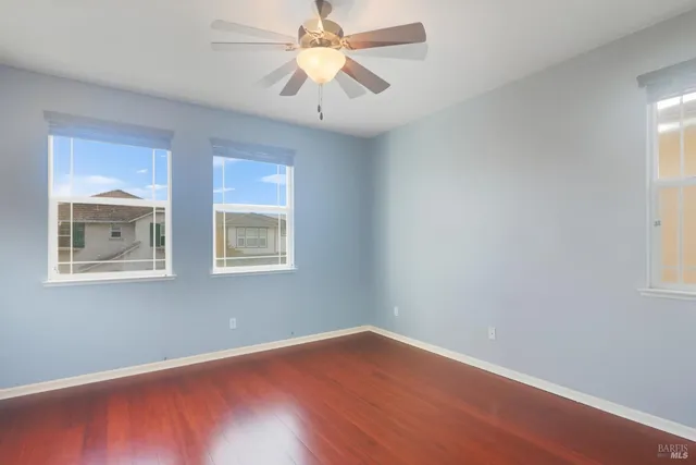 a bedroom with a bed and a potted plant