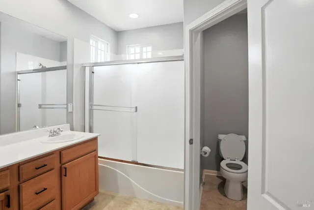 a bathroom with a sink a vanity and a mirror