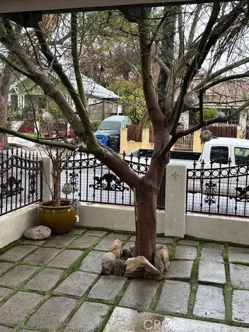 a front view of a house with outdoor seating