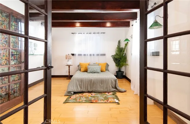 a bedroom with furniture and a window