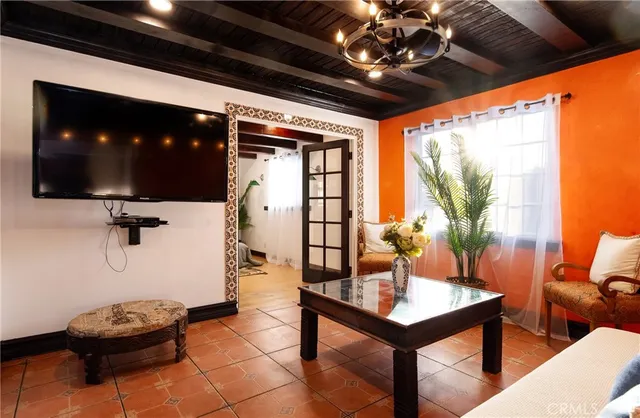 a living room with furniture and a flat screen tv