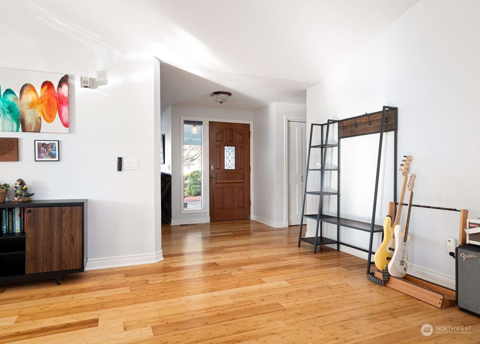 1450 Southwest Islander Lane Oak Harbor, WA 98277 - Photo 14 of 40 a view of a hallway with wooden floor and furniture