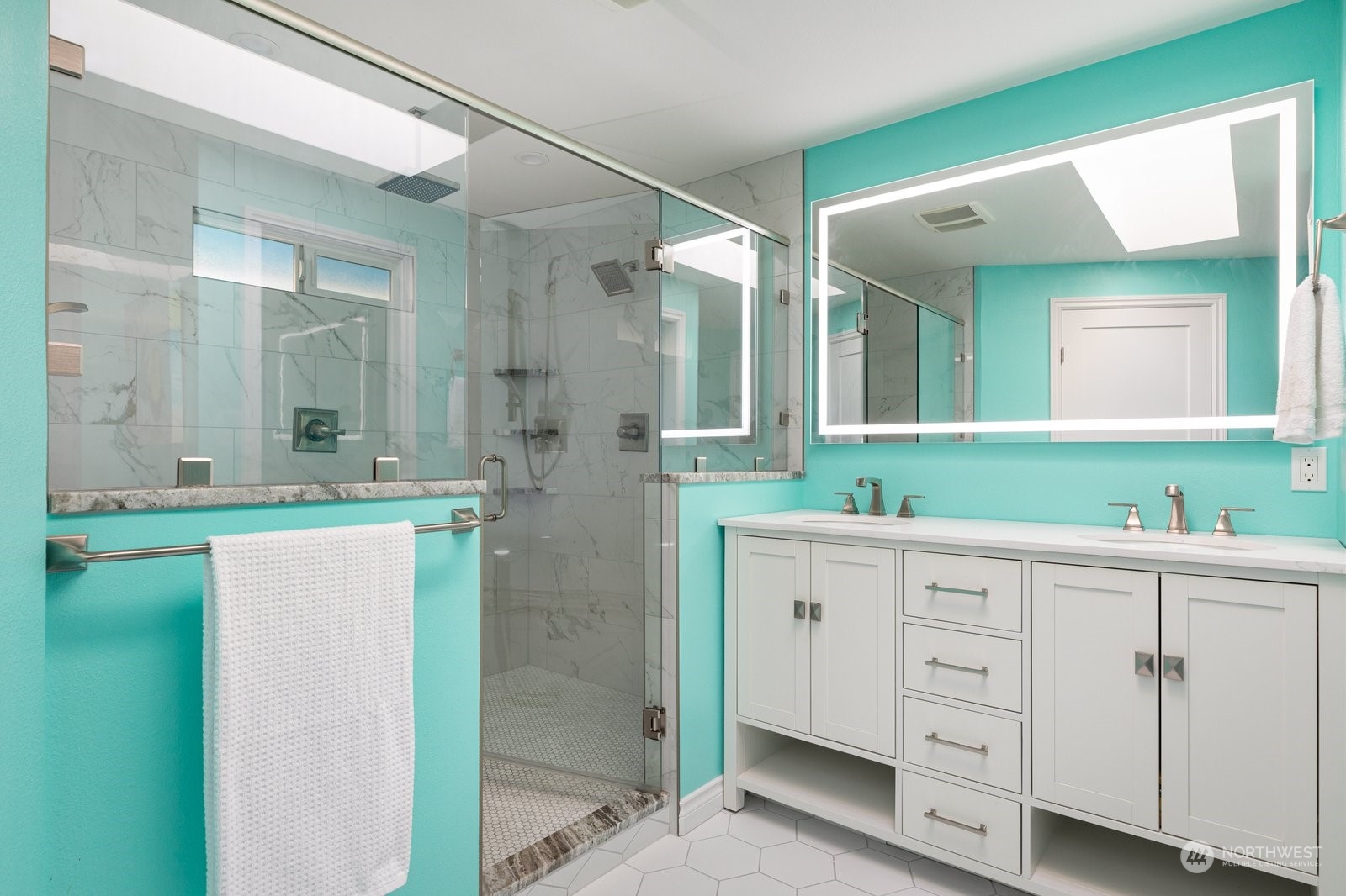 1450 Southwest Islander Lane Oak Harbor, WA 98277 - Photo 23 of 40 a spacious bathroom with a double vanity sink and a mirror