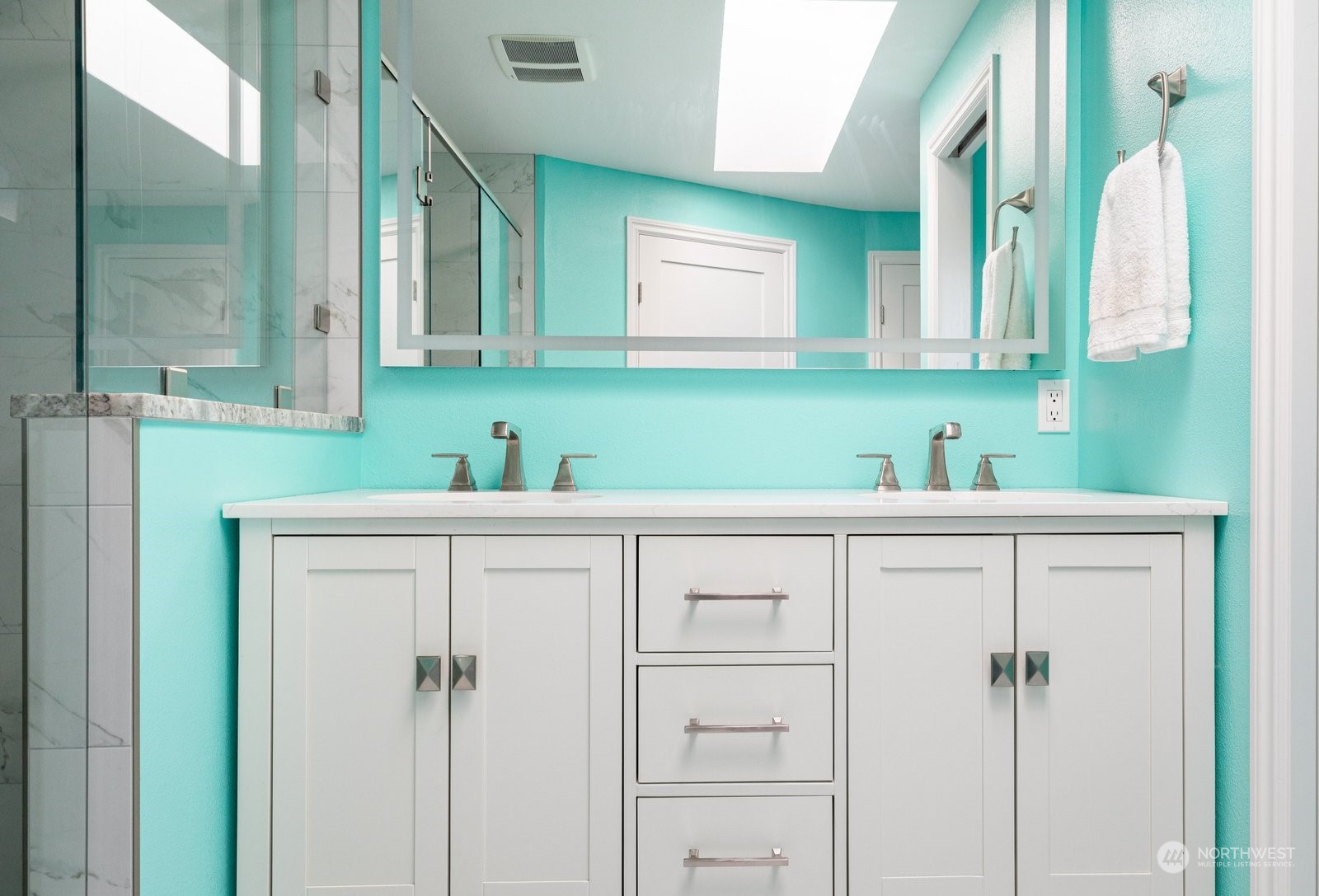 1450 Southwest Islander Lane Oak Harbor, WA 98277 - Photo 25 of 40 a bathroom with a sink and a mirror