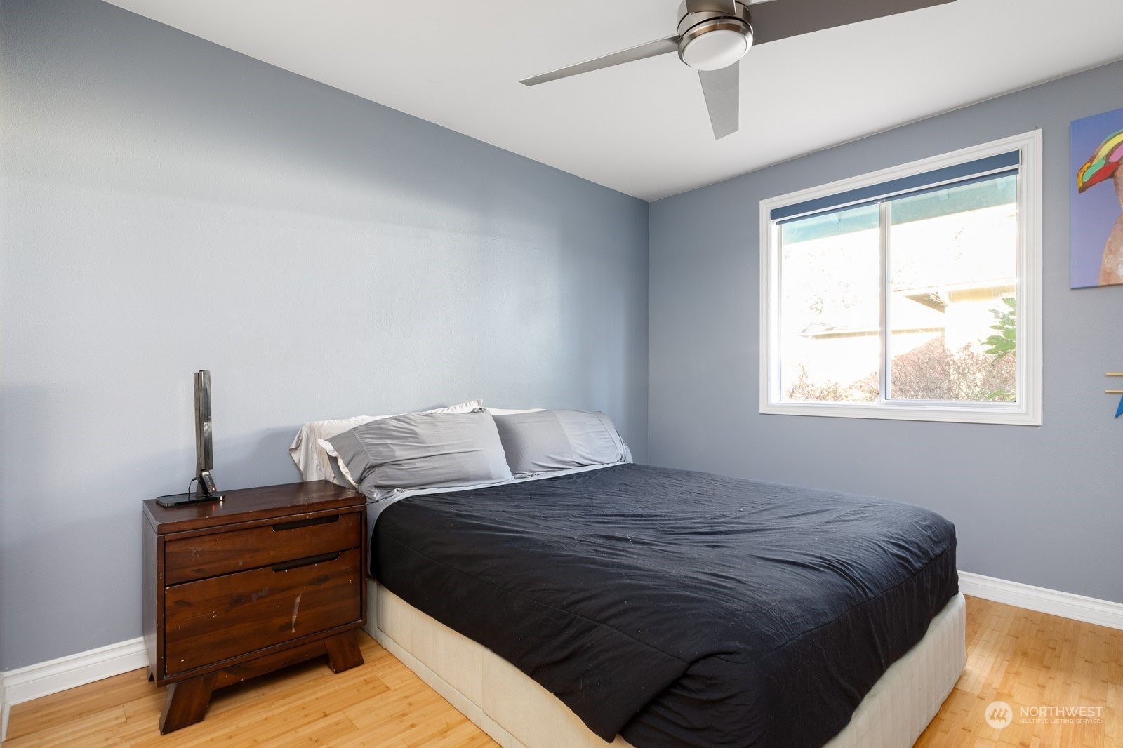 1450 Southwest Islander Lane Oak Harbor, WA 98277 - Photo 30 of 40 a bed sitting in a bedroom next to a window