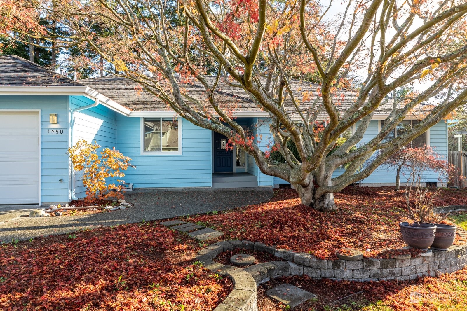 1450 Southwest Islander Lane Oak Harbor, WA 98277 - Photo 3 of 40 a front view of a house with garden