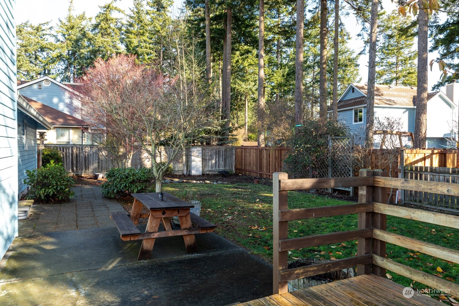1450 Southwest Islander Lane Oak Harbor, WA 98277 - Photo 35 of 40 a wooden bench sitting in backyard of house