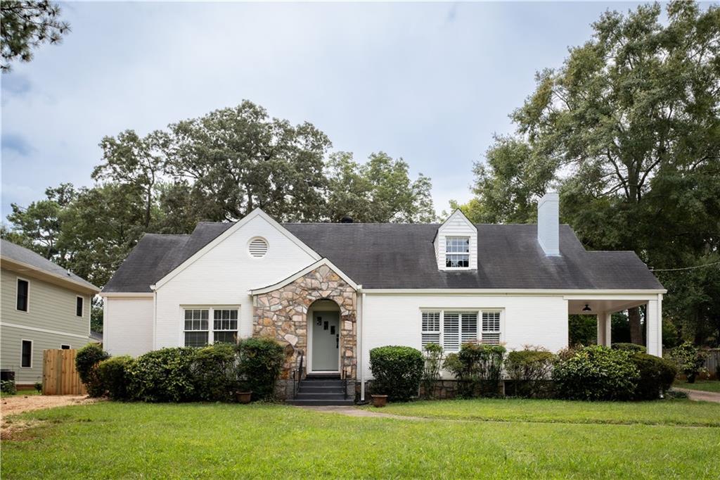 2929 East Pharr Road Atlanta, GA 30317 - Photo 1 of 1 a front view of a house with a garden