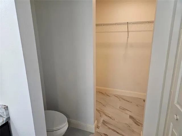 a bathroom with a shower toilet and sink
