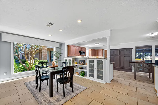a view of a dining room with furniture window and outside view