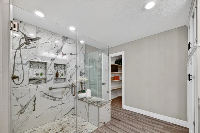 a room with lots of wooden furniture and a window