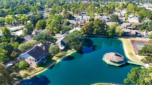 an aerial view of a house with a garden lake view