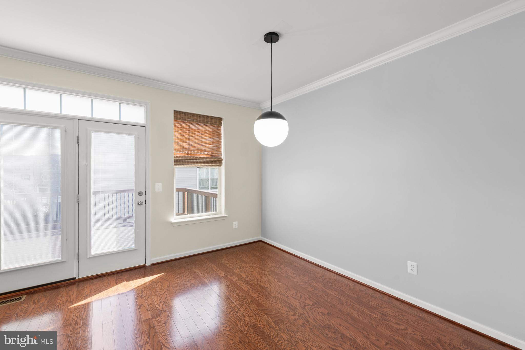 210 Flyfoot Drive Stephenson, VA 22656 - Photo 20 of 38 a view of an empty room with wooden floor and a window