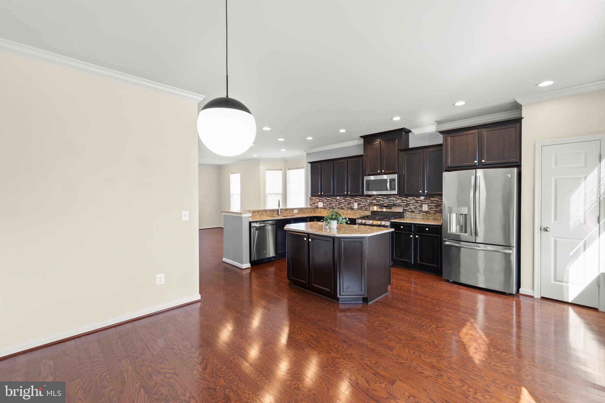210 Flyfoot Drive Stephenson, VA 22656 - Photo 21 of 38 a kitchen with a refrigerator and microwave