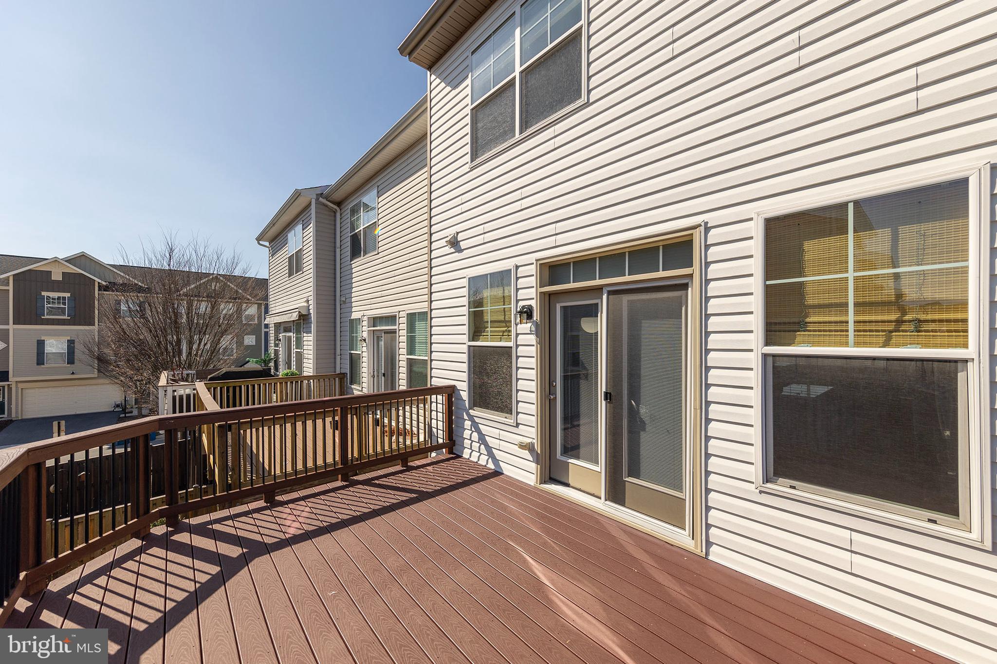 210 Flyfoot Drive Stephenson, VA 22656 - Photo 26 of 38 a view of a wooden deck with large windows
