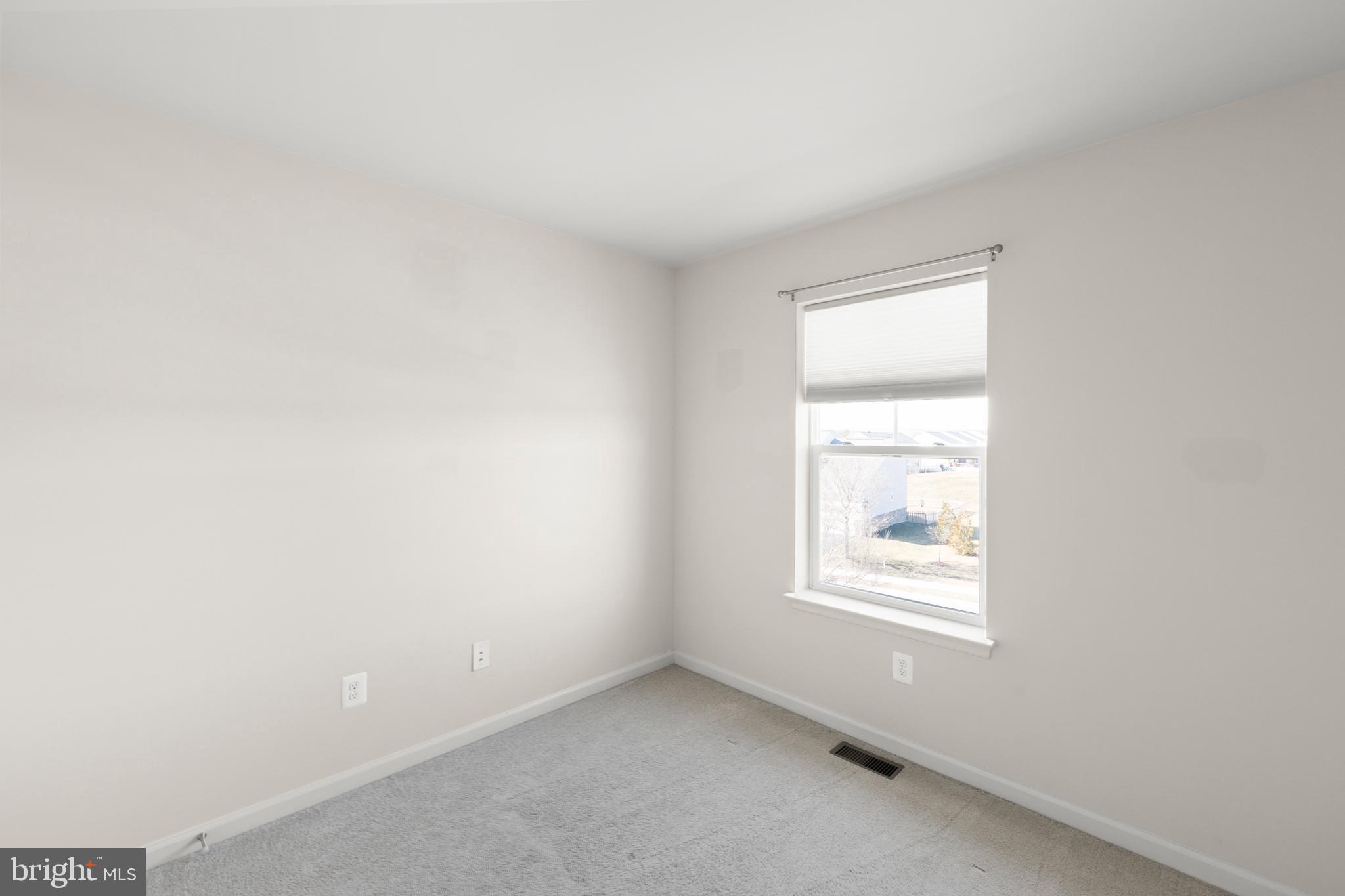 210 Flyfoot Drive Stephenson, VA 22656 - Photo 33 of 38 an empty room with a window