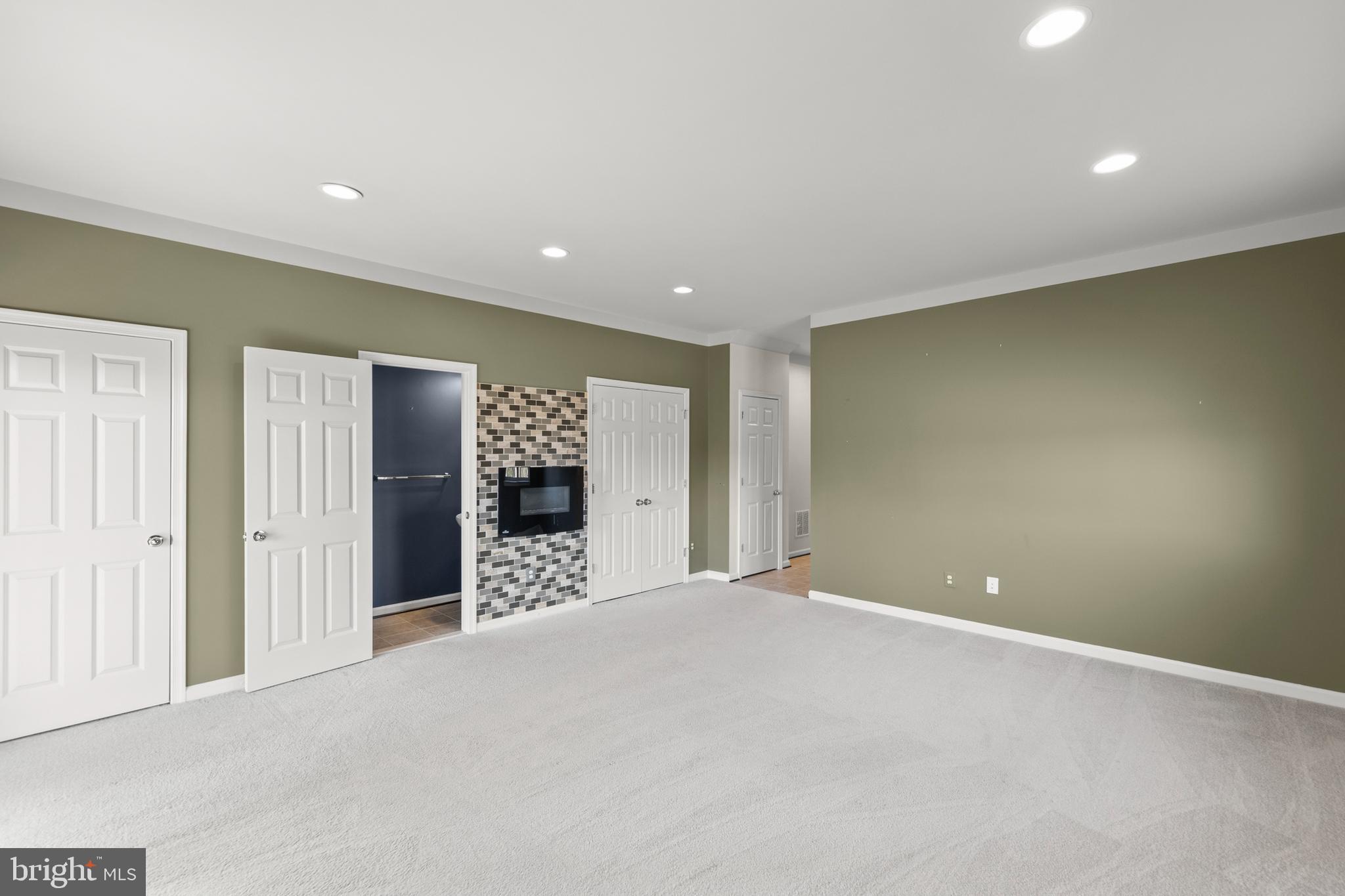 210 Flyfoot Drive Stephenson, VA 22656 - Photo 6 of 38 a view of an empty room with a fireplace