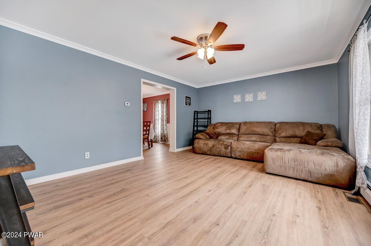 19 Ripple Lane Beach Lake, PA 18405 - Photo 7 of 52 a living room with furniture and a ceiling fan