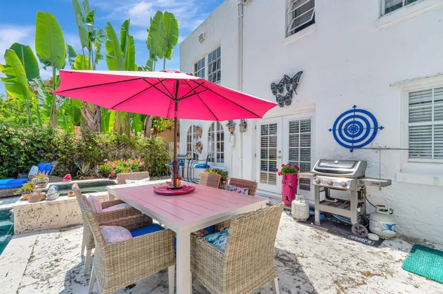 a view of a backyard with sitting area