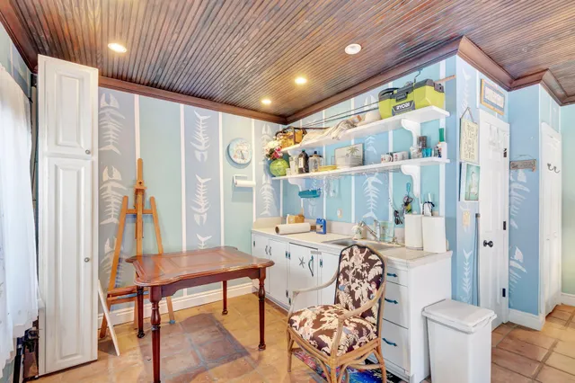 an outdoor space with seating area and trees around