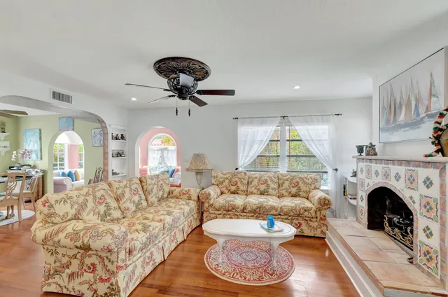 a living room with furniture and a fireplace