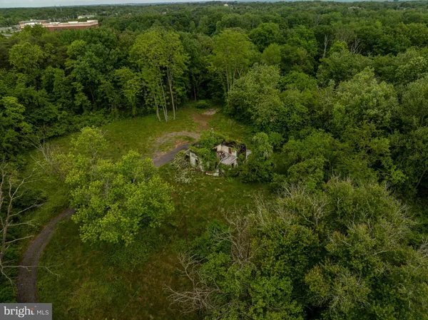 a view of a city with green field