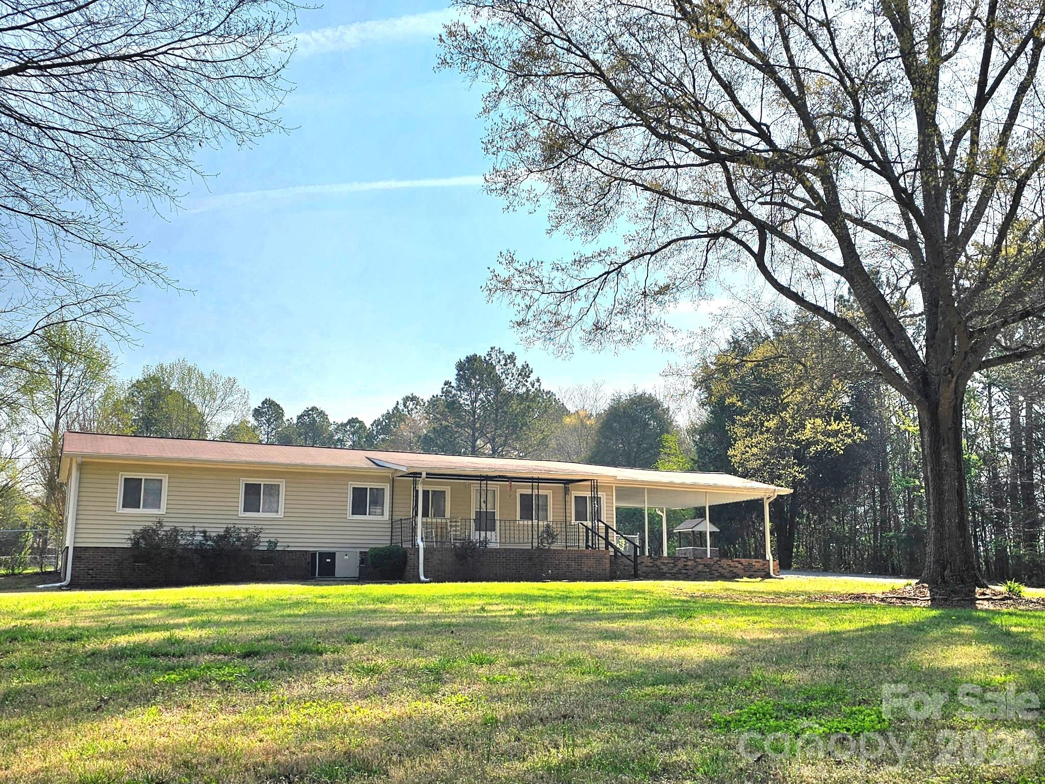 44716 Gold Branch Road Richfield, NC 28137 - Photo 1 of 47 a front view of a house with a garden